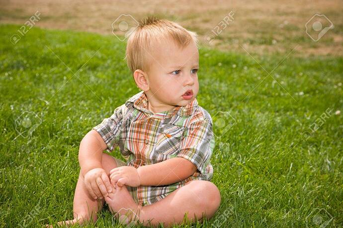 A Portrait Of A Cute One Year Old Baby Boy At A Park. Stock Photo, Picture  And Royalty Free Image. Image 5489268.