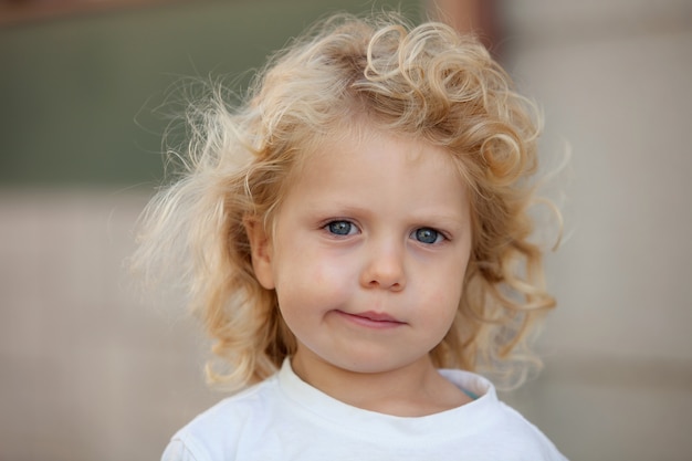 Premium Photo | Beautiful boy three year old with long blond hair