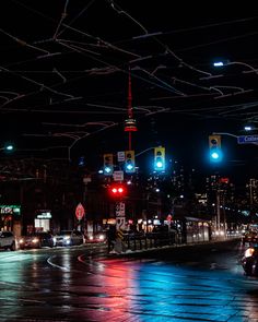 This contains an image of: Toronto on a rainy night